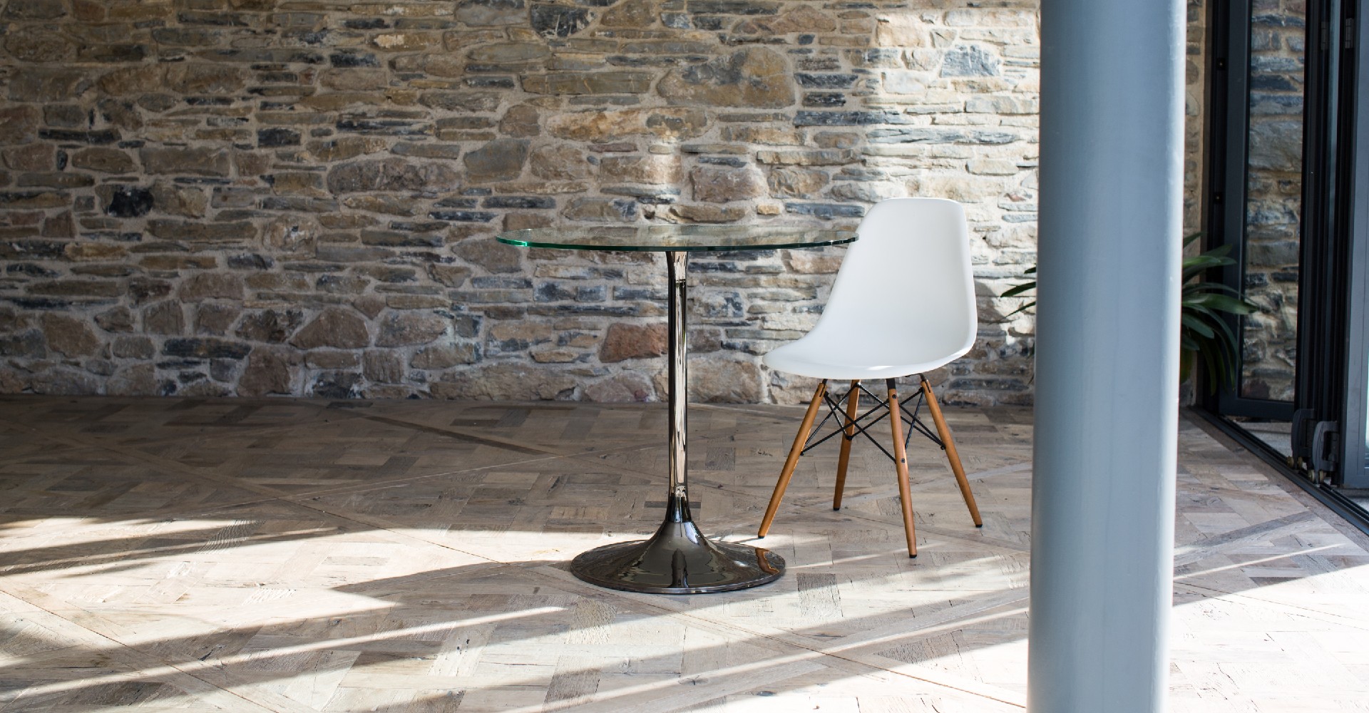 Swan Small Dining Table With Clear Glass Top & Black Chrome Pedestal © GillmoreSPACE Ltd