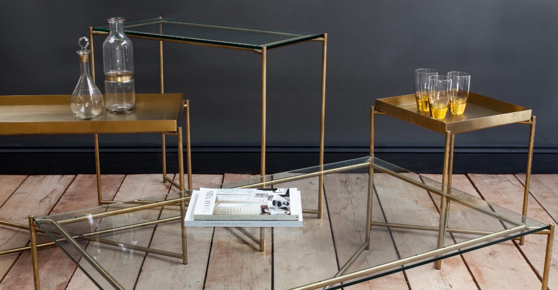 Iris Clear Glass And Brass Tray Top Tables by Gillmore © GillmoreSPACE Ltd