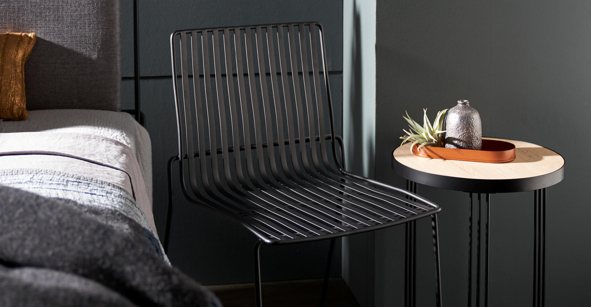 Finn Black Dining Chair And Light Wood Side Table Detail © GillmoreSPACE Ltd