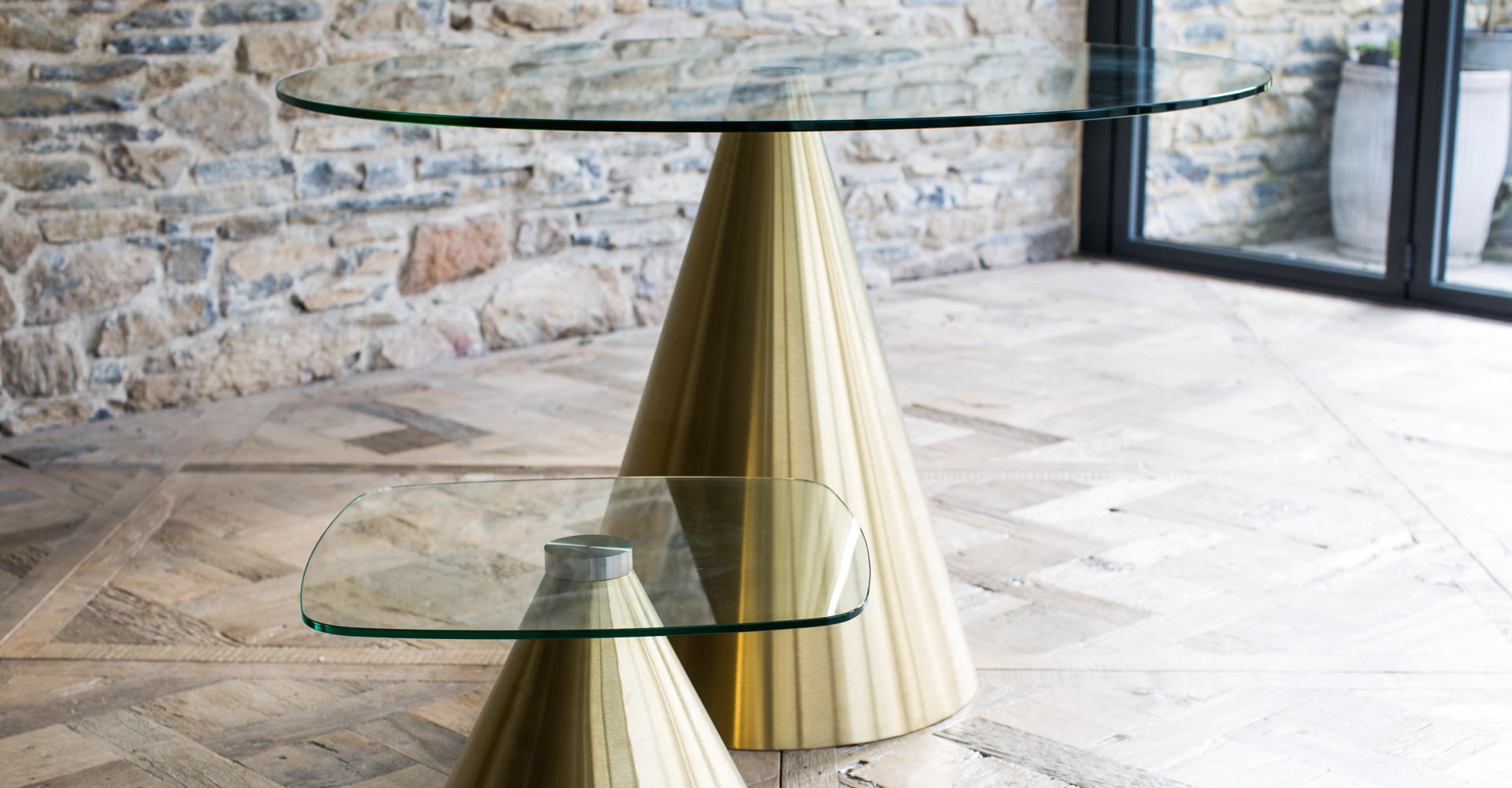Oscar Clear Glass Dining Table & Side Table With Brass Pedestals © GillmoreSPACE Ltd